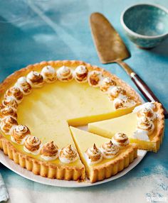 a cheesecake on a plate with a knife and fork