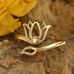 Adjustable Ring with Lotus Design. A beautiful ring fit for all finger sizes. This ring is available in sterling silver or natural bronze. You may select your metal finish by using the drop down menu to the right. *Bronze is an alloy that consists of a mixture of copper and tin, approximately 90% copper and 10% tin. Our natural bronze styles are solid bronze. Available in Bronze and Sterling Silver Sizing starts at Size 7 Related Item: Tiny Circle Charm with Lotus Design Ohm Jewelry, Lotus Flower Ring, Gold Wrap Ring, Lotus Ring, Lotus Earrings, Namaste Yoga, Lotus Design, Gold Ring Designs, Bronze Ring