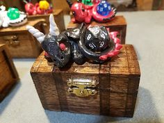 two wooden boxes with dice heads on them