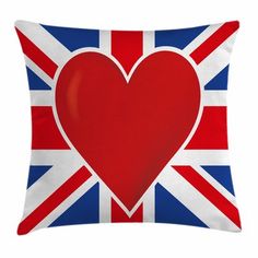 a red heart on a blue and white pillow with the british flag in the background