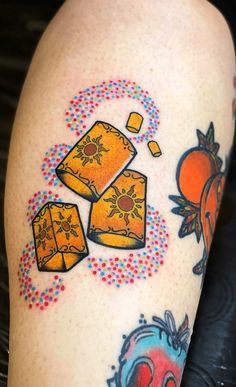 an image of a tattoo on someone's leg that has candy and candies all over it