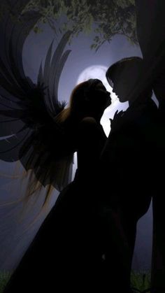 two people are kissing in the dark with an angel wings on their head and trees behind them