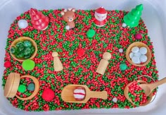 a tray filled with lots of different types of food on top of a white table