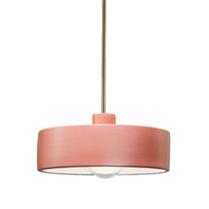 a pink lamp hanging from a ceiling fixture