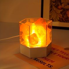 a light that is sitting on top of a box with some rocks in the middle