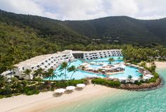 an aerial view of the resort and beach