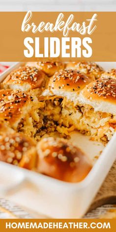 a casserole dish filled with breakfast sliders and topped with sesame seed sprinkles