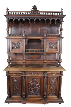 an old fashioned wooden cabinet with carvings on the front and side panels, inlaid to wood