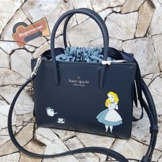 () Disney Alice In Wonderland Shopper Satchel Bag Wkr00599 $329 Blue Kate Spade Dust Bag Not Included Nwt (New With Tag) () No Trades, No Dust Bag More Details: Authentic Material: Leather Dual Rounded Handles Crossgrain Ribbon Drawstring Closes Cloth Interior Optional, Adjustable Crossbody Strap. Silver Tone Hardware Protective Feet At The Bottom Of Bag Front Logo Interior Zip Pocket Interior Slip Pocket Dimensions: 7" H X 8.4" W X 3.1" D Dual Handles: 3.54" Drop Adjustable Crossbody Strap Plea Kate Spade Disney Everyday Bag, Kate Spade Disney Style Everyday Bags, Nightmare Before Christmas Purse, Disney Kate Spade, Paw Wallpaper, Kate Spade Disney, Luxury Tote Bags, Disney Alice In Wonderland, Pinterest Ideas