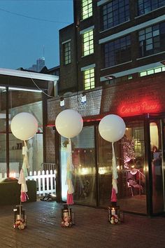 some white and red lights on the side of a building