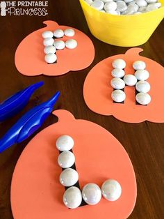 the letter j is made out of marshmallows and sits on a table