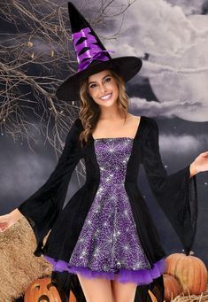 a woman in a witch costume posing for the camera