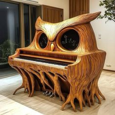 an owl - like piano is made out of wood