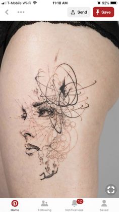 a woman's thigh with an abstract tattoo on it