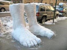 there is a fake snow foot on the sidewalk