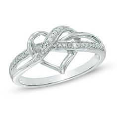 a white gold ring with diamonds in the middle and an intertwined design on top