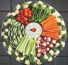 a platter filled with lots of different types of vegetables