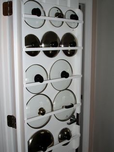 a kitchen cabinet with plates and bowls on it