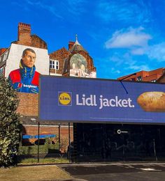 a large billboard on the side of a building with a giant potato in front of it