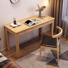 a wooden desk with a clock on the wall above it and a chair next to it