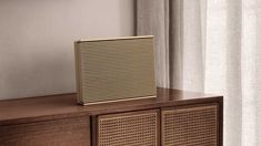 a radio sitting on top of a wooden cabinet