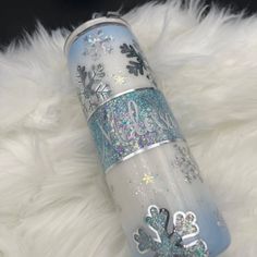 thermos is decorated with snowflakes and glitters on white fluffy fur