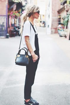 On Mary Seng of Happily Grey: Hudson Jeans London Overalls ($245) in Night Train; Sandro t-shirt; Nike Free 5.0 TR Fit 4’ Training Shoes ($100) in Black/Cool Grey/White; Nixon The 51-30 Chrono Watch ($500) in Matte Black/Gunmetal. @WhoWhatWear Happily Grey, Outfit Jeans, Outfit Trends, Mode Inspo, Inspiration Mode, Looks Style, Mode Inspiration, Outfits Casuales, Look Fashion