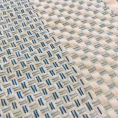 an upholstered fabric with blue lines on it