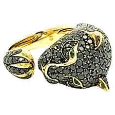 Embrace sophistication with our "Wild Panther" ???????? 18K Yellow Gold Exclusive Ring, featuring mesmerizing Emeralds and Black Diamonds. Crafted to perfection, this ring boasts 0.03 ct of emeralds and 4.94 ct of black diamonds, promising elegance and allure. ???? Embrace the symbolism of the panther, representing courage and power, and the timeless beauty of emeralds and black diamonds, symbolizing strength and sophistication.  ???? Global delivery and quality assurance await from our Swiss-bo Wild Panther, Black Diamonds, Family Heirloom, Cocktail Rings, Black Diamond, Precious Metals, Panther, Timeless Beauty, Precious Stones