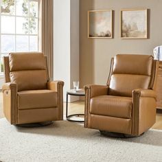 two brown recliners sitting on top of a white rug