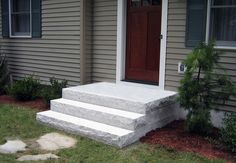 a house with steps leading up to the front door