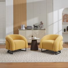 two yellow chairs sitting on top of a wooden floor next to a white rug and table