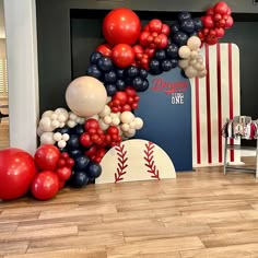 balloons are arranged in the shape of baseballs and bats on display at a sports themed birthday party