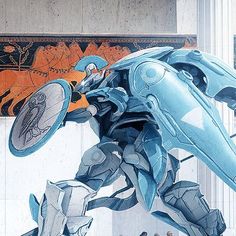 a large blue robot standing in front of a painting on the side of a building