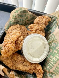 fried chicken and dipping sauce in a basket