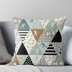 a throw pillow with skis and mountains on it