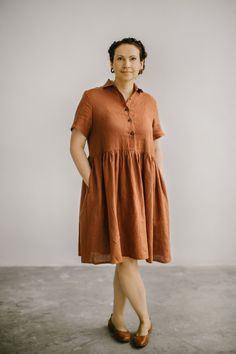 Casual plus size linen dress with cute wooden buttons in the front, 3/4 sleeves and full skirt part. This dress has true summer vibe, it is airy, breathable, has perfect midi length - it is your casual elegance for any life moment. Dress has two comfortable inseam side pockets and boat neckline. Linen fabric I use for all my garments is linen organic fabric, that has medium weight and thus is breathable and absolutely skin-friendly. Choose one of 25 colors in the color palette and enjoy this and Brown Cotton Shirt Dress For Summer, Bohemian Short Sleeve Midi Dress With Buttons, Bohemian Midi Dress With Buttons And Short Sleeves, Bohemian Dresses With Button Closure And Short Sleeves, Short Sleeve Linen Sundress, Bohemian Linen Midi Dress With Short Sleeves, Bohemian Short Sleeve Linen Midi Dress, Short Sleeve Linen Dress With Button Closure, Relaxed Fit Short Sleeve Midi Dress With Buttons