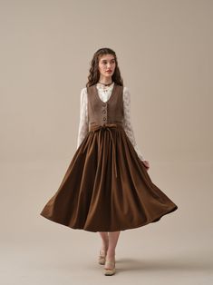 "The search for the perfect wardrobe staple ends with this remarkable wool skirt. Made from premium wool fabric, the soft wool creating gentle whispers with every step as you walking briskly through the autumn leaves. Finished with feminine pleats and belt detailing, it effortlessly combines romance, elegance and practicality into one stunning piece. Versatile and easy to style, this wool skirt seamlessly pairs with a variety of tops and accessories, transforming any outfit into a statement of refinement. Discover the endless possibilities and elevate your wardrobe with this wool skirt. 【Fabric】 -Wool 87%, Elastane 13% 【Length】 33-34 inches. 【Size】 *SIZE XS  length: 33.5\"/85 cm waist: 26\"/ 66 cm *SIZE S  length: 33.5\"/85 cm waist: 27\"/ 70 cm *SIZE M  length: 33.5\"/85 cm waist: 29/ 75 Fall Long Skirt Lined Dress, Long Lined Skirt Dress For Fall, Flowy Skirt Dress For Fall, Winter Dress With Long Pleated Skirt, Winter Long Pleated Dress, Fall Dresses With Full Gathered Skirt, Fall Dresses With Gathered Full Skirt, Spring Wool Midi Skirt, Fall Midi Dress With Relaxed Skirt