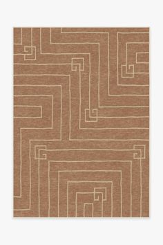 a brown rug with squares and lines on it