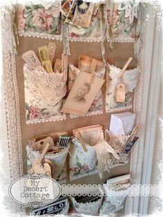 an assortment of items are displayed on a shelf in a room that is decorated with lace and doily