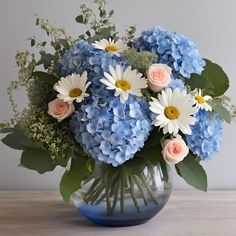 a vase filled with blue and white flowers