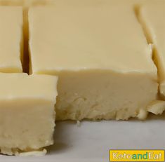 pieces of cheese sitting on top of a white plate