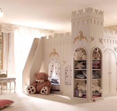 a child's bedroom with a castle bed and stuffed animals in the closets