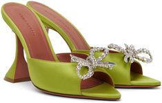 Satin slip-on heeled sandals in green. · Open pointed toe · Crystal-cut bow appliqué at vamp · Logo-embossed goatskin footbed · Covered spool heel with rubber injection · leather sole with rubber injection · Heel: H4 Supplier color: Olivine Spool Heel, Amina Muaddi, Satin Slip, Heeled Sandals, Sandals Heels, Cute Outfits, Slip On, Women Wear, Satin