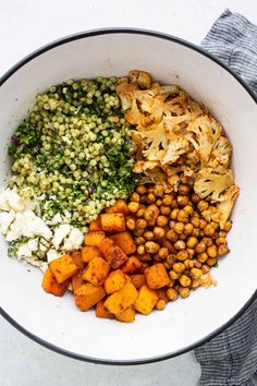 a white bowl filled with different types of food