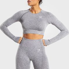 Gymshark Vital Seamless Long Sleeve Crop Top Smokey Grey Marl Extra Small Xs Nwt - Midriff Crop - Raglan Sleeves Detailed With Figure-Contouring Shades - Sweat-Wicking Fabric - Thumb Holes - 59% Nylon, 34% Polyester, 7% Elastane - Label Colour: Smokey Grey Marl Womens Exercise Routine, Gymshark Vital Seamless, Seamless Crop Top, Long Sleeve Activewear, Womens Clothing Patterns, Gymshark Women, Performance Wear, Christmas 2020, Active Wear Outfits