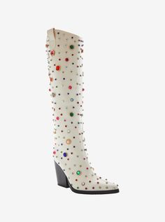 Bring some style to the wild west! These white boots feature a western-inspired rounded knee-high shaft  a pointed toe silhouette  a towering chunky heel  pull tabs  and an easy pull-on fit. Complete with opulent embellished detailing  consisting of assorted gemstones  faux pearl-adorned gold-tone hardware and sparkling rhinestone accents.Listed in women's sizes.Heel: 3 34''Polyurethane upper; rubber soleImported These Boots Are Made For Walking, Painted Cowgirl Boots, Eras Tour Shoes, White Boots Women, Bedazzled Boots, Gogo Boots Outfit, Chloe 2024, Fun Boots, Taylor Concert