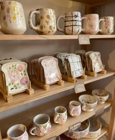 many different types of coffee cups on shelves