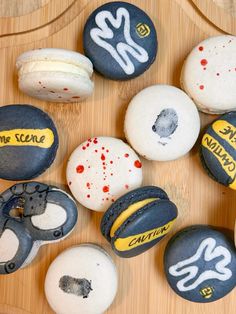 there are many different types of donuts on the wooden table with words painted on them