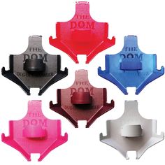 four different colored bottle openers with the words the dom on them